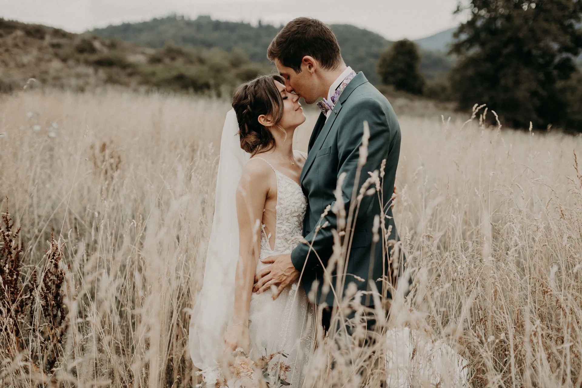 Newlyweds in a golden field in Alsace, France
